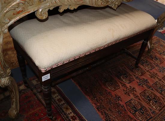A late Victorian mahogany duet piano stool, W.92cm, D.39cm, H.46cm